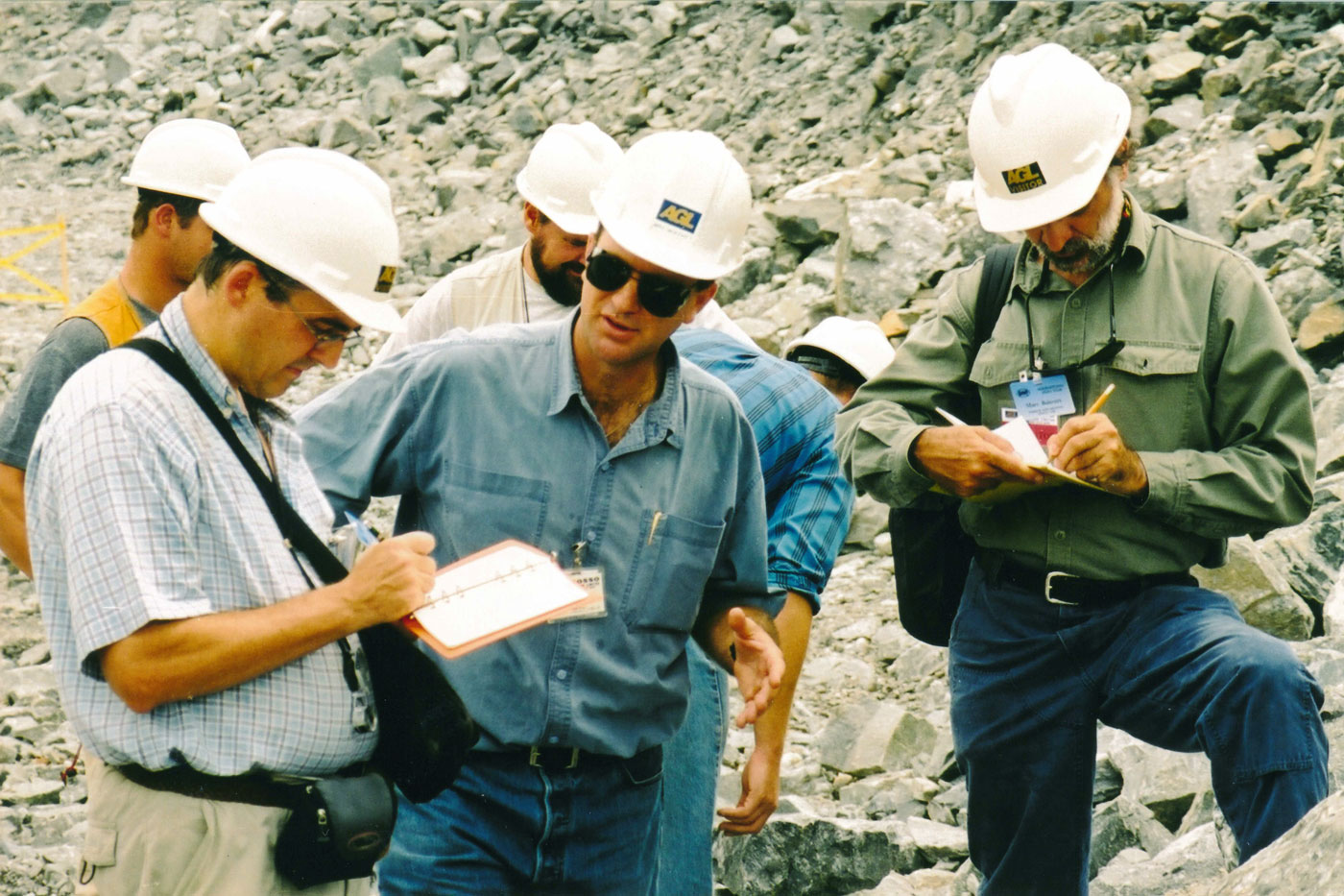 [Mike McKevitt (centre) of Abosso Mines explains the geology of the Damang Mine, Ghana.]